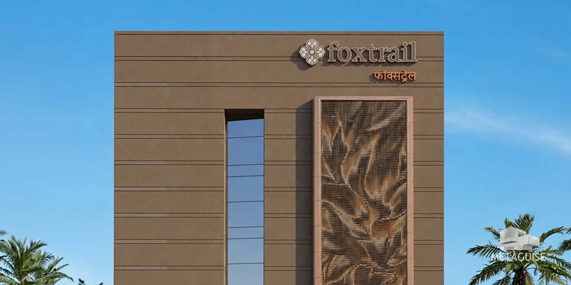 Metal facade with a perforated leaf-pattern panel beside a slim window on a commercial building