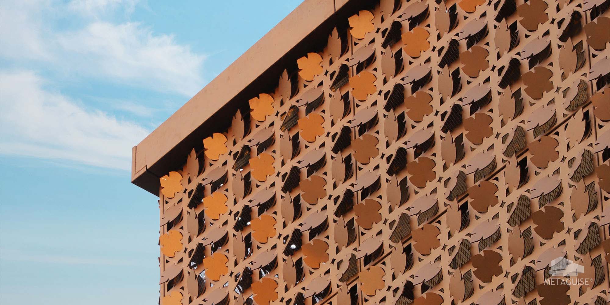 parametric metal facade with perforated panels designed for heat reduction and airflow in Indian climate
