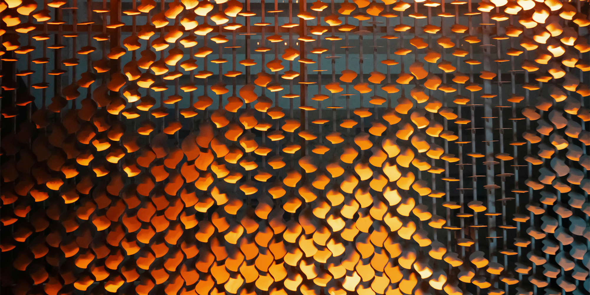 Perforated metal facade cladding used in modern commercial building exterior